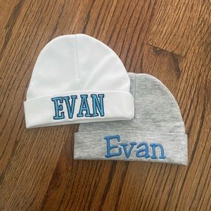 Brand new never worn embroidered newborn hats that says Evan